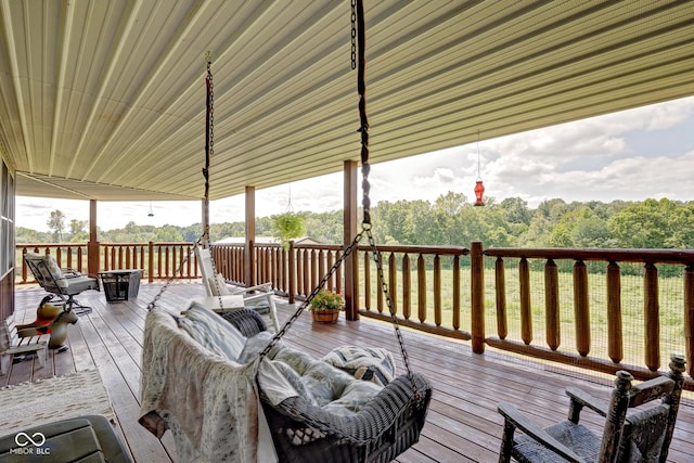 wooden deck with a forest view