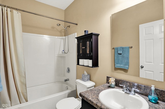 bathroom with toilet, vanity, and shower / bath combo