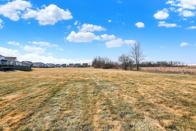 view of yard with a rural view