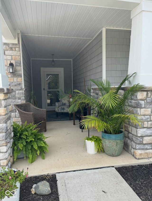 entrance to property featuring covered porch