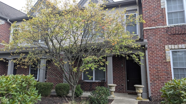 view of front of home featuring brick siding