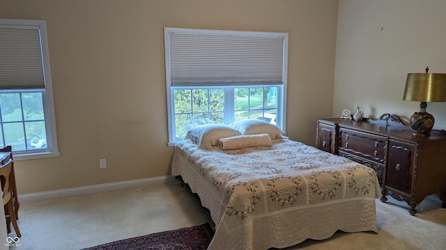 bedroom featuring carpet flooring and baseboards