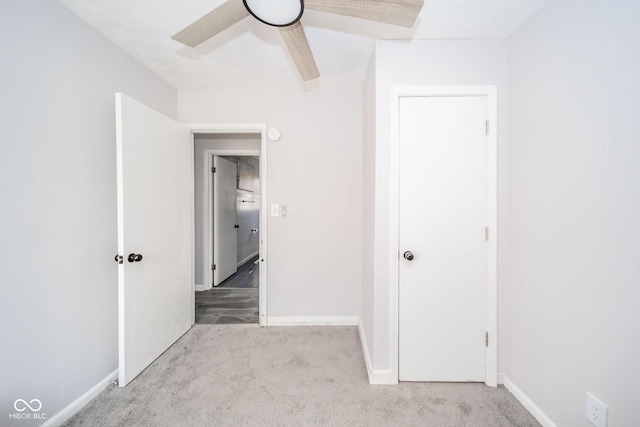 unfurnished bedroom featuring carpet floors, ceiling fan, and baseboards