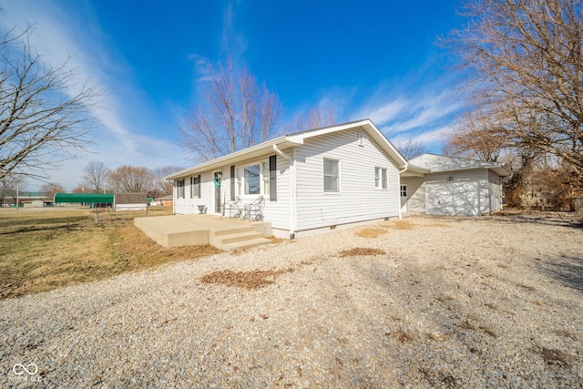 exterior space featuring crawl space, driveway, and an attached garage