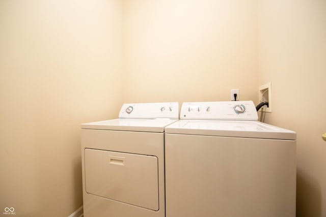 laundry area featuring separate washer and dryer and laundry area