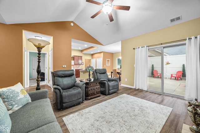 living room with visible vents, a ceiling fan, wood finished floors, high vaulted ceiling, and baseboards