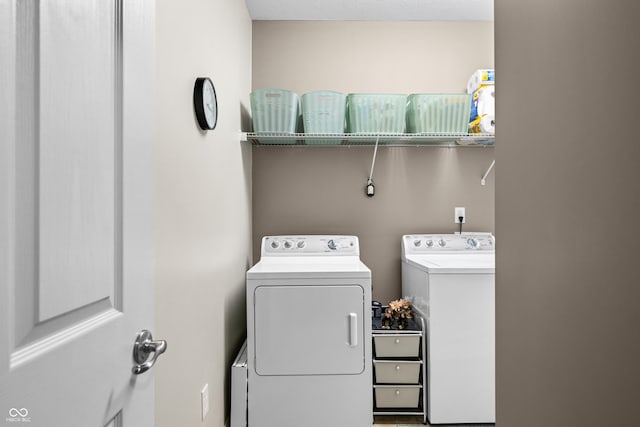 laundry room featuring laundry area and washing machine and clothes dryer