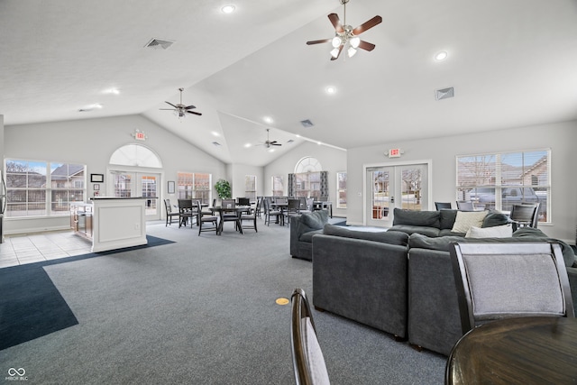 living room featuring a healthy amount of sunlight, carpet, and visible vents