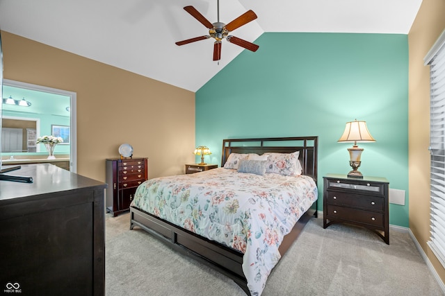 bedroom featuring a ceiling fan, lofted ceiling, light colored carpet, and baseboards