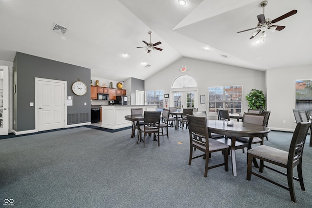 dining area featuring visible vents, dark carpet, a ceiling fan, high vaulted ceiling, and baseboards