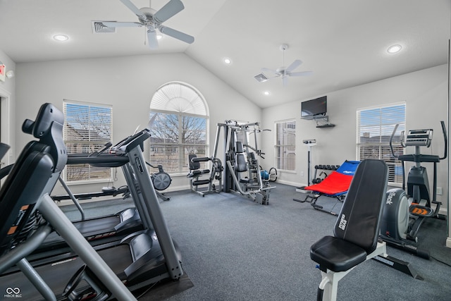 workout area featuring lofted ceiling, a ceiling fan, visible vents, and a healthy amount of sunlight