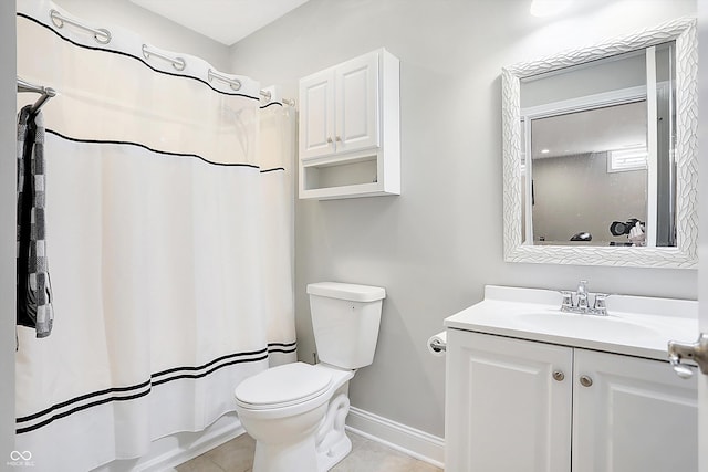 bathroom with baseboards, a shower with shower curtain, toilet, tile patterned floors, and vanity