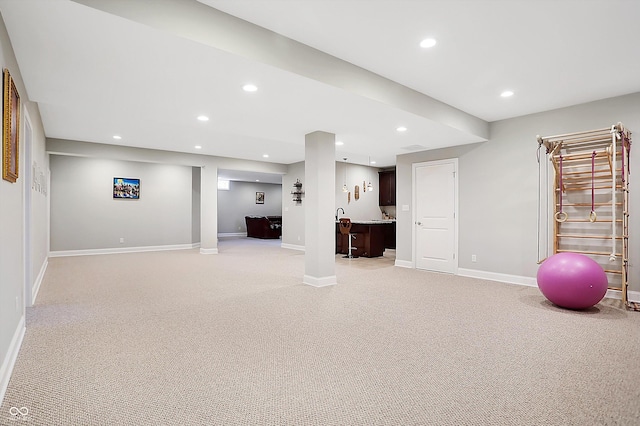 finished basement with light carpet, baseboards, and recessed lighting