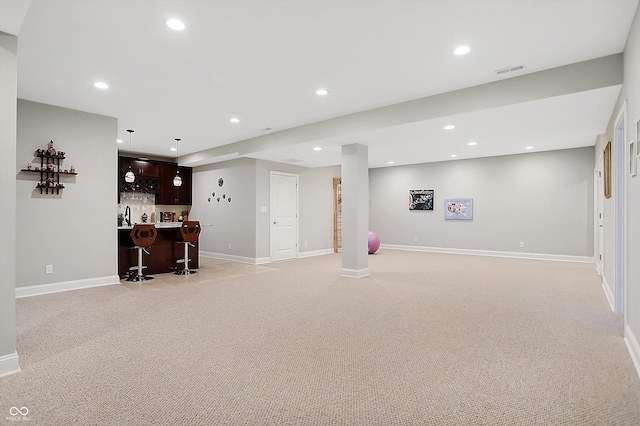 bar with baseboards, visible vents, light colored carpet, indoor wet bar, and recessed lighting