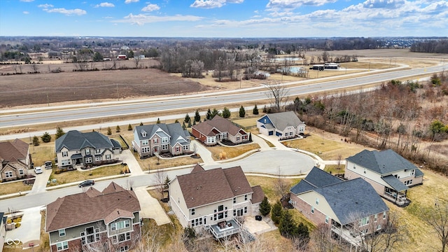 birds eye view of property with a residential view