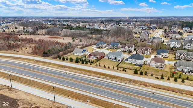 birds eye view of property with a residential view