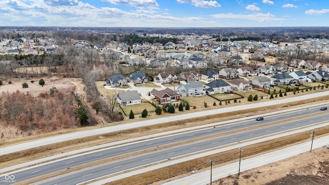 birds eye view of property with a residential view