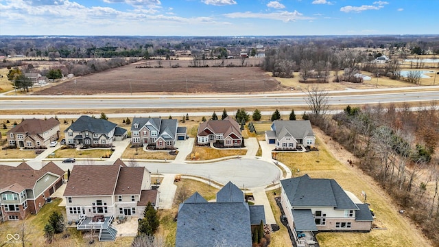 birds eye view of property with a residential view