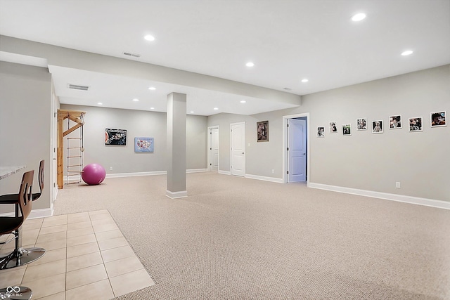 interior space featuring recessed lighting, light colored carpet, visible vents, and baseboards