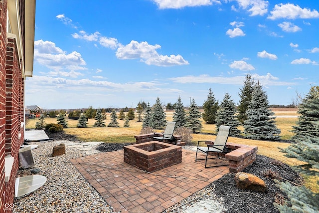 view of patio / terrace with an outdoor fire pit