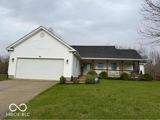 130 Hanover Dr, Morristown, IN 46161 - view of front of house featuring covered porch, driveway, a front yard, and an attached garage