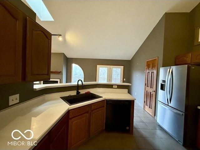 130 Hanover Dr, Morristown, IN 46161 - kitchen featuring stainless steel refrigerator with ice dispenser, a sink, dishwasher, vaulted ceiling, and a skylight