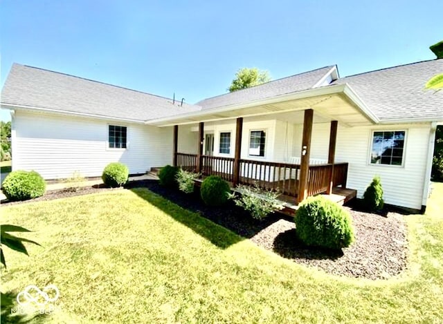 130 Hanover Dr, Morristown, IN 46161 - rear view of property with a yard, a porch, and a shingled roof