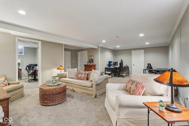 living room with recessed lighting, carpet floors, ornamental molding, and a decorative wall