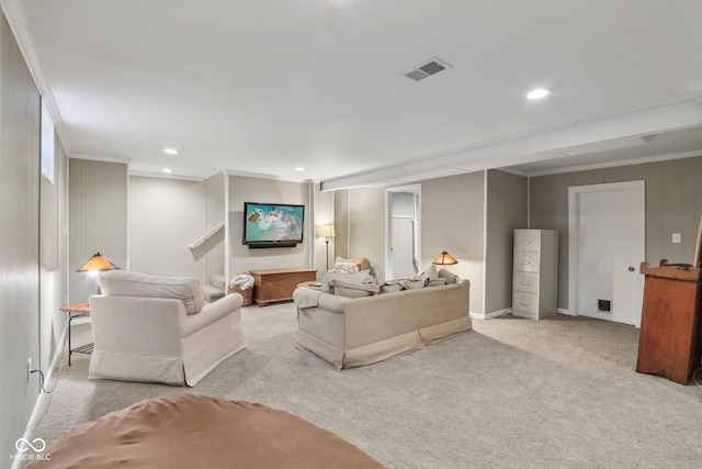 carpeted living room with recessed lighting, visible vents, and ornamental molding