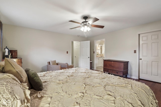 bedroom with baseboards, dark wood-style flooring, ensuite bathroom, and ceiling fan