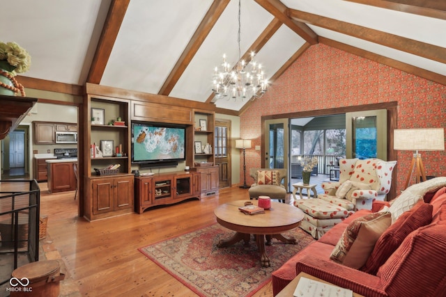 living room featuring light wood-type flooring, beam ceiling, a chandelier, and wallpapered walls