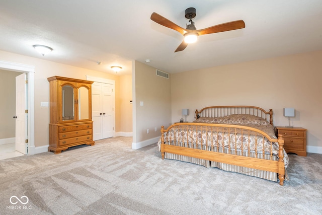 carpeted bedroom with visible vents and baseboards