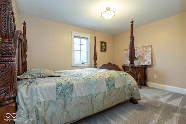 bedroom with carpet floors and baseboards