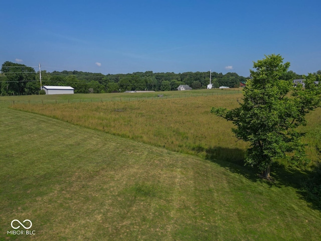 view of yard with a rural view