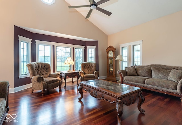 living room with baseboards, high vaulted ceiling, ceiling fan, and wood finished floors