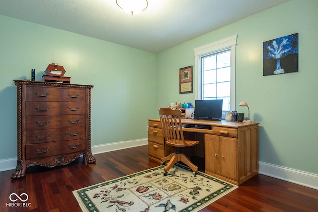 office with baseboards and dark wood-style flooring