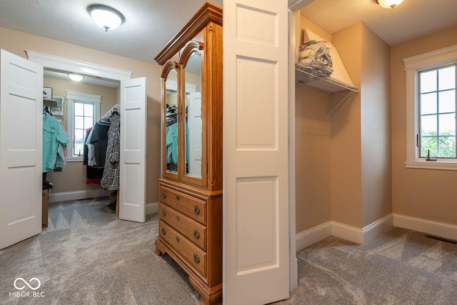 walk in closet with carpet flooring and visible vents