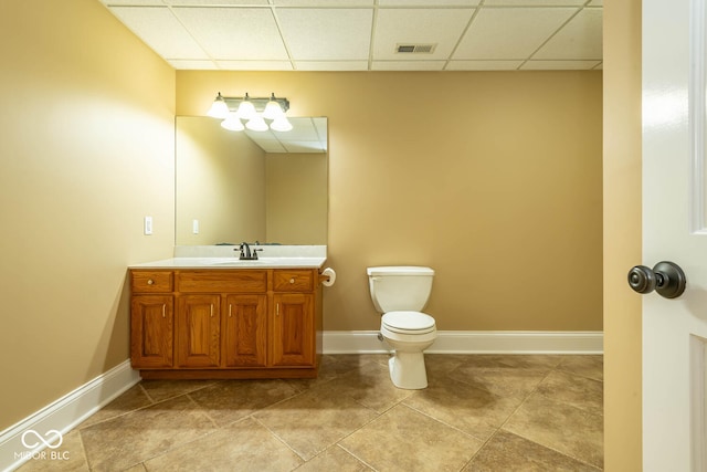 bathroom with toilet, baseboards, visible vents, and vanity