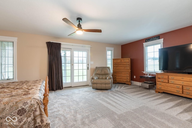 carpeted bedroom featuring access to outside, baseboards, and ceiling fan