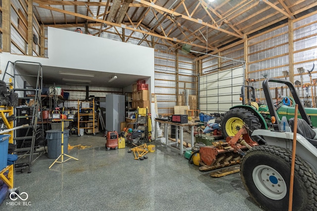 garage featuring a workshop area and metal wall