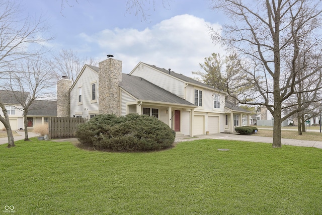 view of front of property featuring driveway, a garage, a chimney, and a front lawn