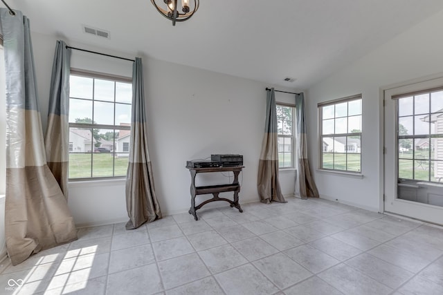 unfurnished room with a wealth of natural light, visible vents, and vaulted ceiling