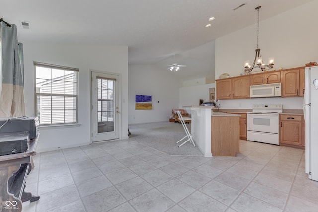 kitchen with white appliances, visible vents, a breakfast bar area, open floor plan, and light countertops