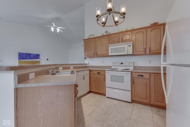 kitchen featuring white appliances, light tile patterned floors, a peninsula, light countertops, and a sink