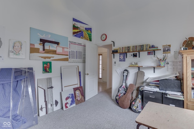 game room featuring lofted ceiling and carpet