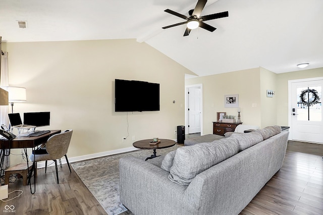 living room featuring lofted ceiling with beams, wood finished floors, visible vents, baseboards, and a ceiling fan