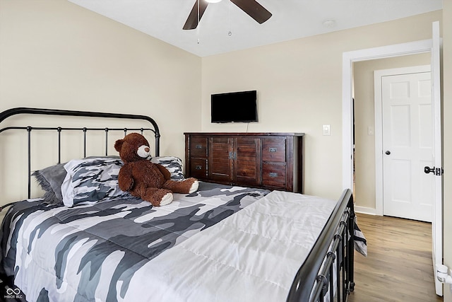 bedroom featuring ceiling fan and wood finished floors