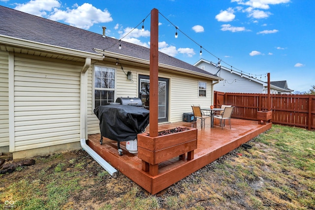 deck featuring fence and area for grilling