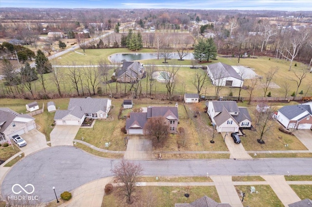 birds eye view of property featuring a residential view and a water view