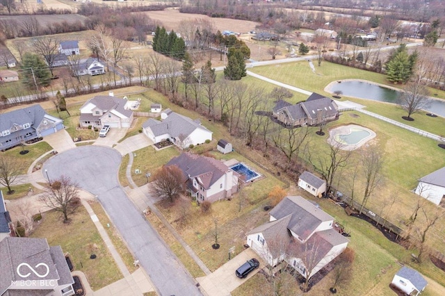 aerial view with a residential view and a water view